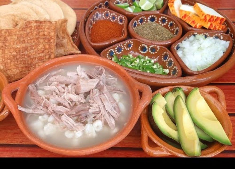 Pozole with tostadas, avocado and trimmings